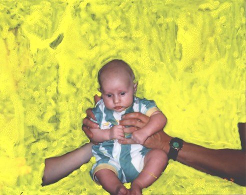 Cutout photo of baby over painted yellow background