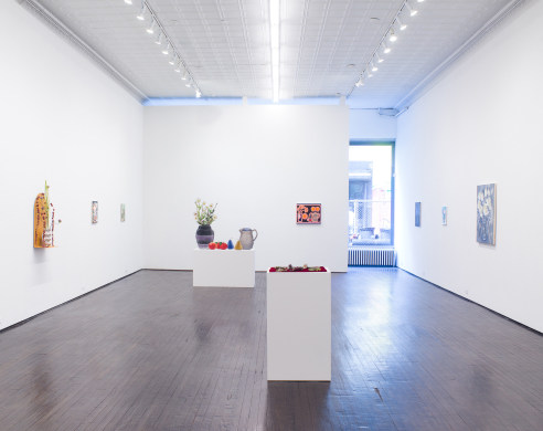 Gallery view of exhibition featuring ceramics, paintings and sculpture 