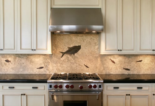 Fossil stone backsplash made from large honed slabs of fossil rich limestone
