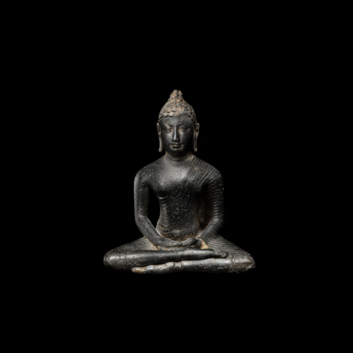 This small Buddha from the Anuradhapura period sits in the half-lotus posture (virasana), his right leg over his left