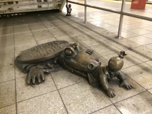 The story behind the strange 8th Ave. subway statues