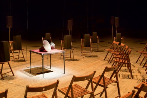 Chairs arranged in a circle facing a speaker