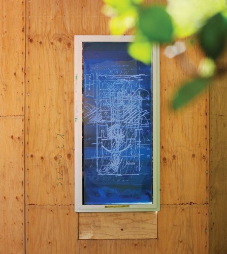 blue window drawing on plywood structure