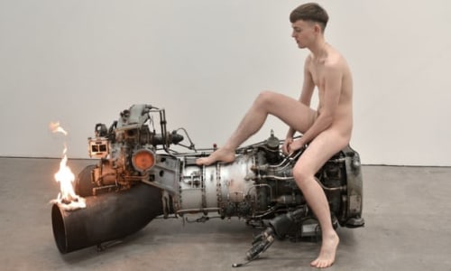 man sitting on engine