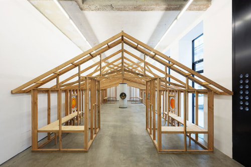 Base structure of a pitched roof building, made with wood planks