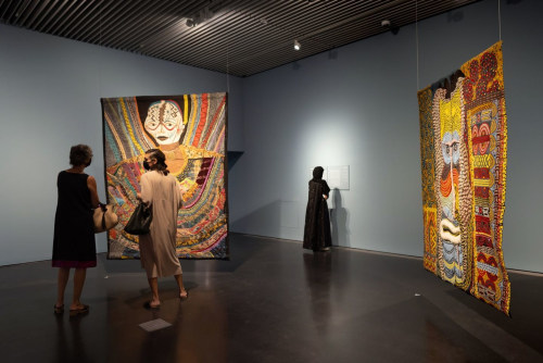 Left to right: Pacita Abad, Door to Life (1998–2004); Door Connects Me to the Greatest Happiness I Have Known (1999). Oil, painted cloth, buttons stitched on padded canvas. Exhibition view: Pacita Abad, I Thought the Streets Were Paved With Gold, Jameel Arts Centre, Dubai (13 September 2021–13 February 2022). Courtesy Jameel Arts Centre.