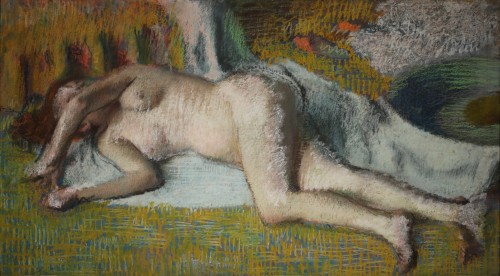 The picture is a pastel by Edgar Degas from the Nahmad Collection, depicting a nude red haired female laying on the floor admist shimmering colors.