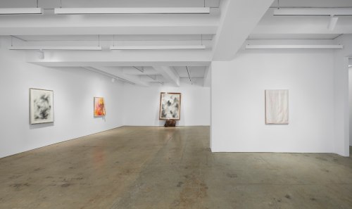 This image is an installation view of the exhibition David Hammons: Basketball and Kool Aid. It shows one of the gallery room, displaying on the front wall a large scale diptych. On the left wall there is one medium size the top of it covered with fabric. On the right wall there is a medium size painting.