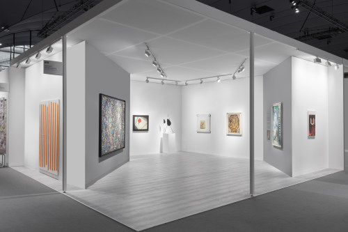 This image shows a the booth of Nahmad Conteporary at the Paris + Art Fair, on the picture is displayed works by Buren, Dubuffet, Calder, Kandinsky, Basquiat, Picasso and Guyton.