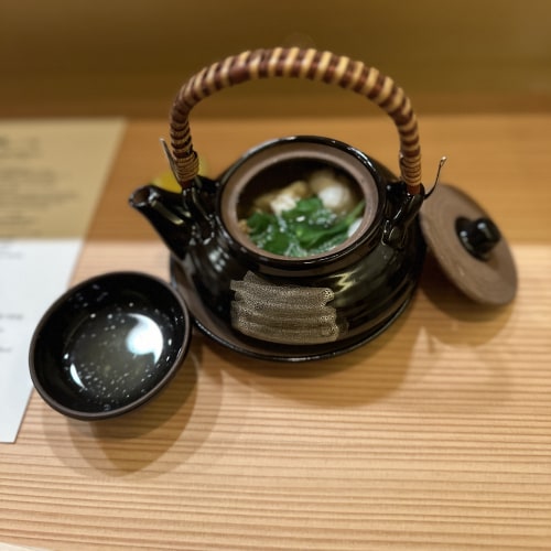 soup delivered in a teapot with bowl