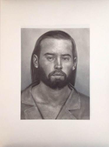 A pencil drawing of a bearded, long haired man