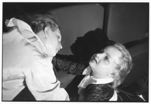 A black and white photograph of 2 female wax dolls in agony
