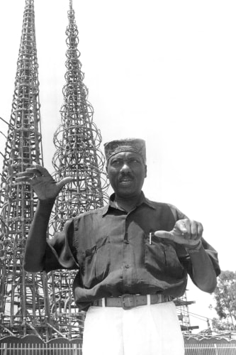 John Outterbridge outside the Watts Towers Art Center in Los Angeles in 1991. He was a leading practitioner of the pieced-together mixed-medium sculpture known as assemblage. Credit: Bart Bartholomew for The New York Times