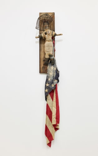 This is an image of an assemblage sculpture made by John Outterbridge between 1979 and 1992 titled: Deja Vu-Do, Ethnic Heritage Series.