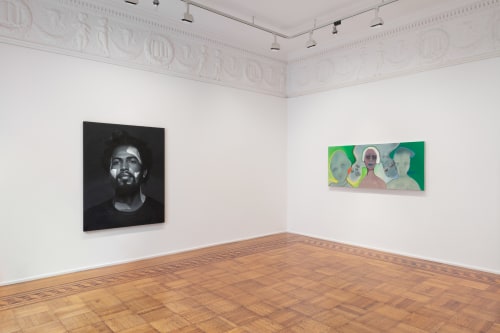 This image is an installation view of the Portraits exhibition at Tilton Gallery picturing a painting by Kohshin Finley on the left and a painting by February James on the right.