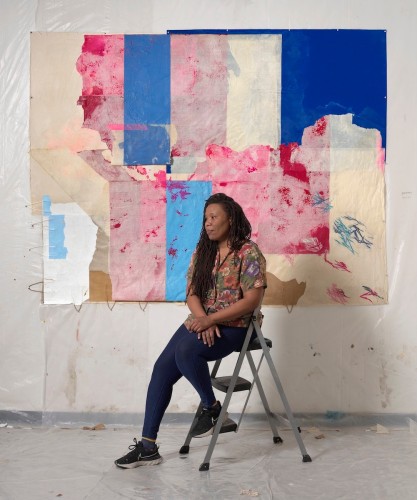 This is an image of the artist Tomashi Jackson in her studio taken by photographer Julia Featheringill.