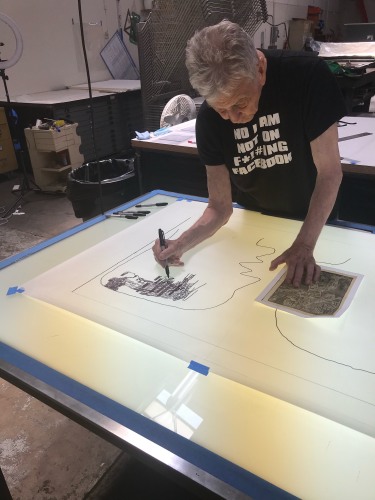 Derek Boshier drawing at the light table at Cirrus, 2021