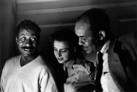 Left to right: Gordon Parks, unidentified woman, and Ralph Ellison