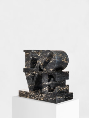 Black portoro marble Love sculpture with the letter l and a tilted letter o atop the letters v and e