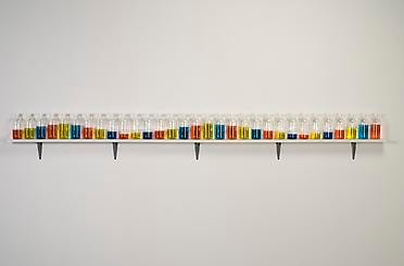 Alt="Tony Feher, (Singer of Many), 2008, 31 glass bottles with screw caps, water, food color and painted wood shelf"