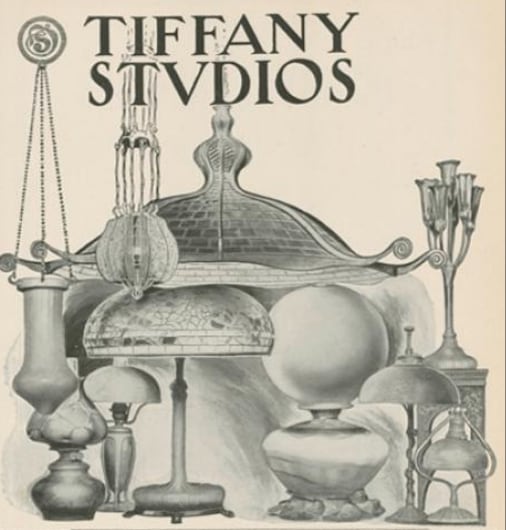 a period advertisement for Tiffany Studios showing a selection of Tiffany Lamps with leaded glass shades and blown Favrile Glass shades, in black and white. 