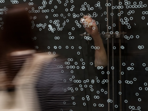 Kibong Rhee, Perpetual Snow, 2015. Installation view, New Romance: Art and the Posthuman, Museum of Contemporary Art Australia, 2016. Glass, silicon, aluminium, steel, marker pen, arduino system. Image courtesy the artist and Museum of Contemporary Art Australia © the artist. Photograph: Alex Davies