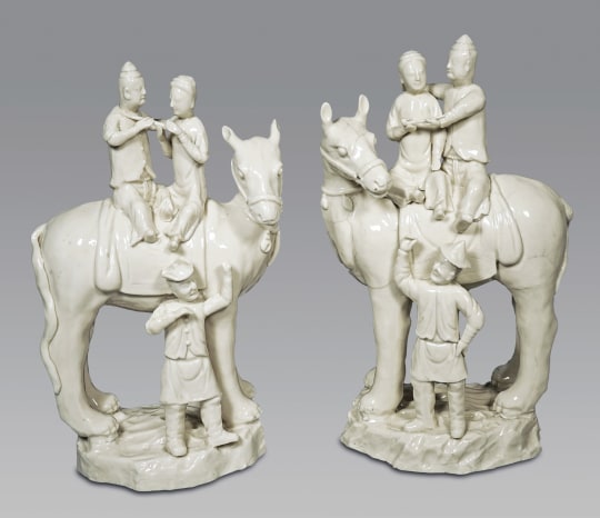 Rare Pair of Blanc de Chine Porcelain Figural Groups Seated on Horses
