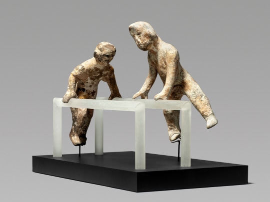 Pair of Chinese Unglazed Pottery Figures of Acrobats