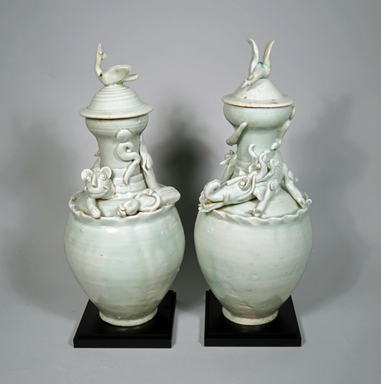 Fine and Rare Pair of Chinese Qingbai Glazed Funerary Vases and Covers