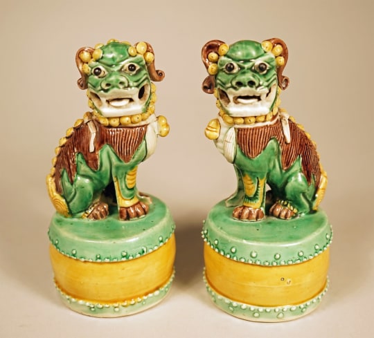 Rare Pair of Chinese Green Glazed Sitting Fu Lions on Drum Pedestals