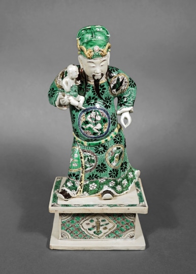 Famille Verte Porcelain Figure of an Immortal Holding a Child
