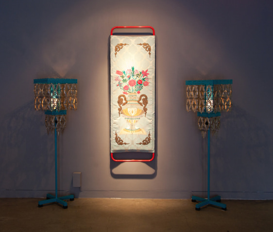 Adeela Suleman PRAYING IN HER RICHLY DECORATED ROOM III (Ed. 1/2) 2012 Embroidery on cloth, iron with powdered paint and custom lamps Stretcher: 73 x 23.5 x 5 in. / Lamps: 51 x 16 x 16 in. (each)