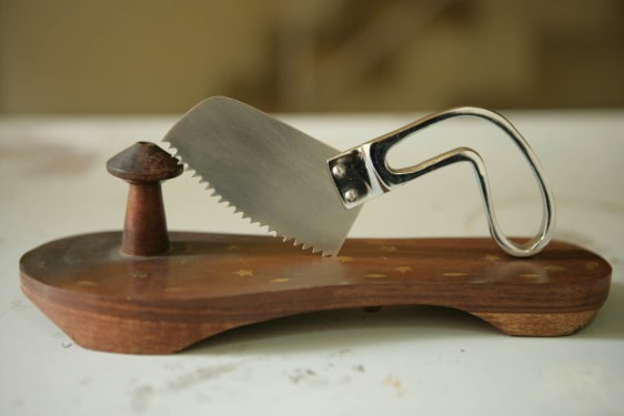 G.R. Iranna  Kiss the God  2009  Wood, stainless steel, and brass  4 x 6 x 8 in