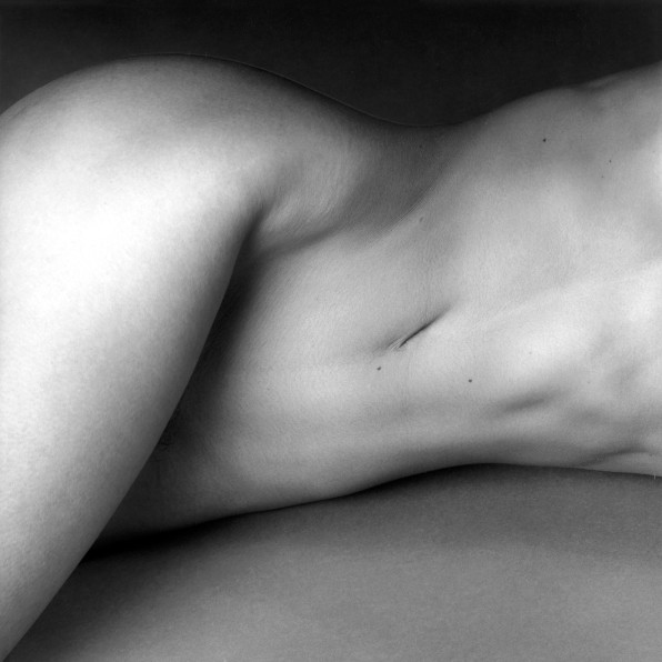 Nude woman's torso.