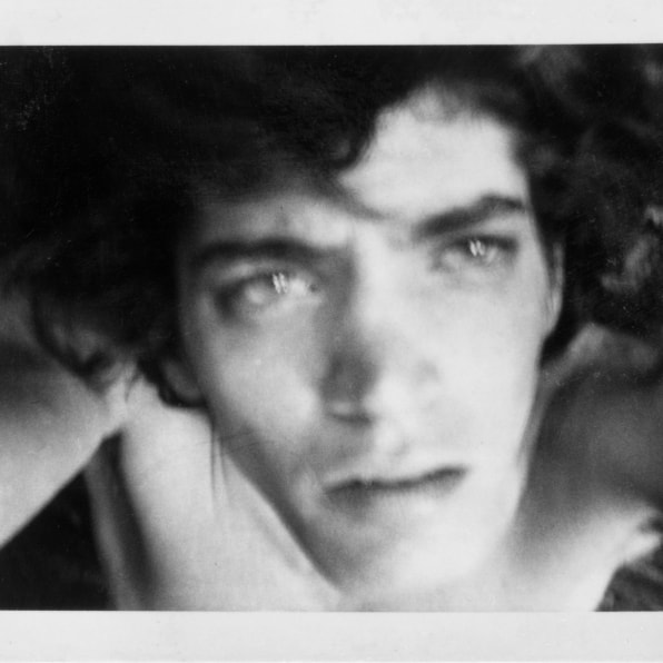 Self-Portrait, Robert Holding the camera above his head, looking up.