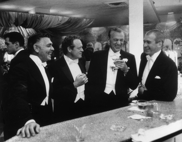 Slim Aarons, Kings of Hollywood, 1957: Clark Gable, Van Heflin, Gary Cooper, and James Stewart at Romanoff&rsquo;s in Beverly Hills