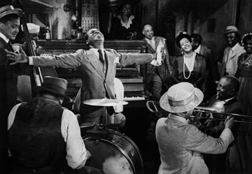 Phil Stern, Louis Armstrong and Billie Holiday in scene from jazz film, New Orleans, 1940s