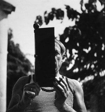 Lee Miller Pablo Picasso holding a sun visor, Hotel Vaste Horizon, Mougins, France, 1937