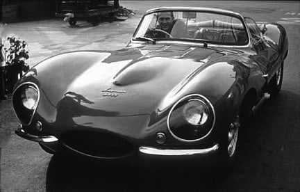 Sid Avery, Steve McQueen Sitting in his XKSS Jaguar, 1960