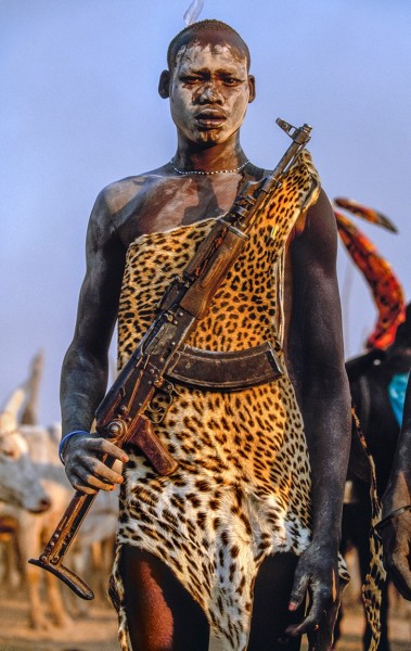 Carol Beckwith and Angela Fisher, Dinka Warrior with Leopard Skin and Kalashnikov Rifle, South Sudan, 2006
