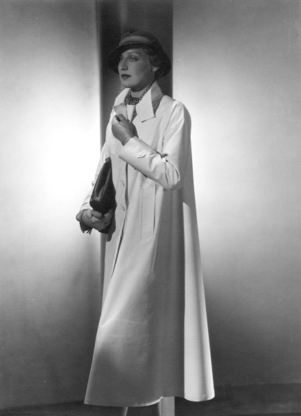 George Hoyningen-Huene, Untitled (Standing model in long white coat with hat, purse, and gloves), Vintage Print