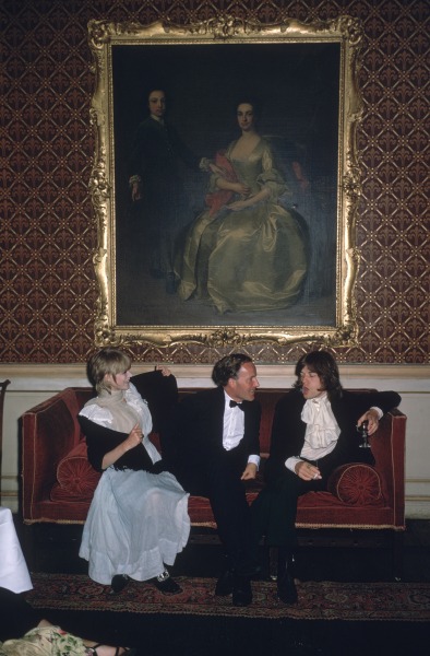 Slim Aarons, Pop and Society: Marianne Faithfull, Desmond Guinness, and Mick Jagger seated in conversation at Guinness's home Leixlip Castle in Ireland, 1968