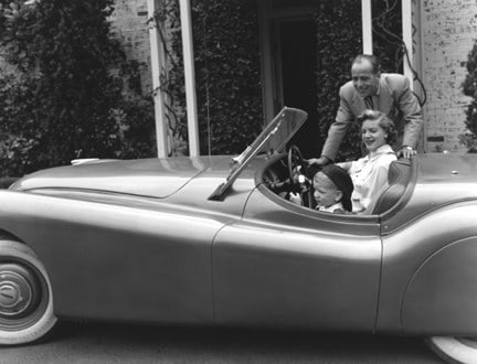 Sid Avery, Humphrey Bogart and Lauren Bacall in their XK120 Jaguar and their Son Steven, 1952