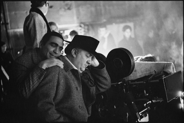 Mary Ellen Mark, Guiseppe Rotunno with Federico Fellini who pretends to sleep on the set of Fellini's Satyricon, Rome, Italy 1969