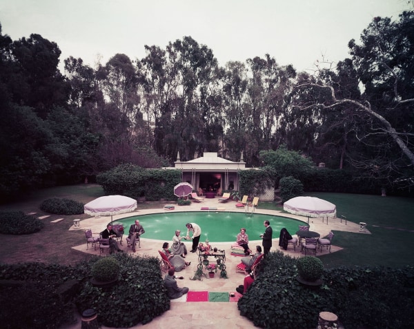 Slim Aarons, Scone Madame?, circa 1960: Guests gather around pool at home of interior decorator James Pendleton