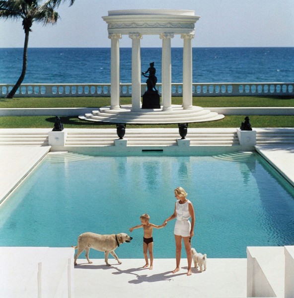 Slim Aarons, The Good Life, 1955: C.Z. Guest and her son Alexander and dog at the pool at their home Villa Artemis in Palm Beach