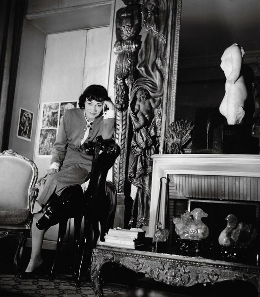 Louise Dahl-Wolfe, Coco Chanel Leaning on Chair in her Apartment, Paris 1954.