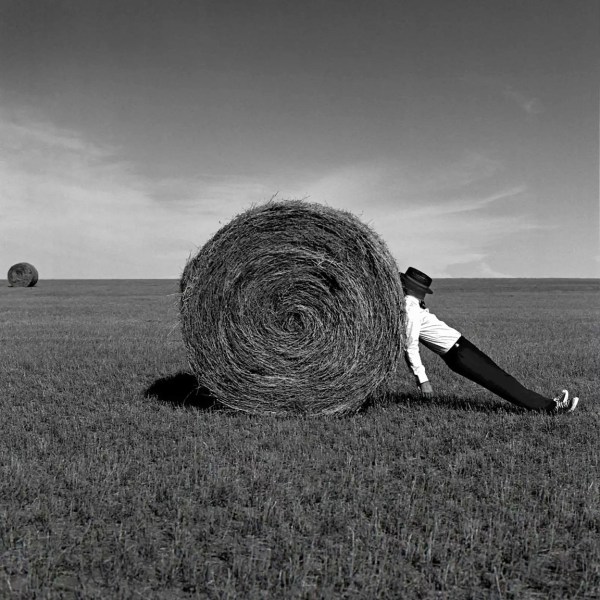 Rodney Smith, Man Leaning Against Hay Bale, Alberta, Canada, 2004