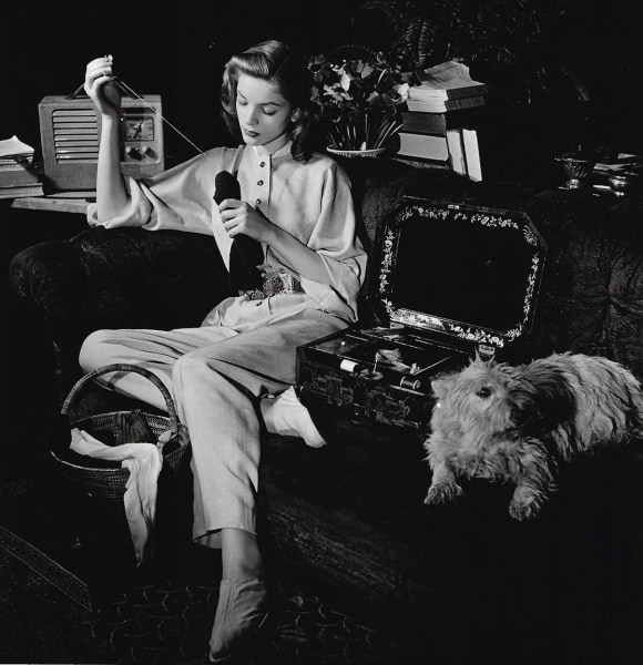 Louise Dahl-Wolfe, Lauren Bacall with Dog (Pulling Thread), 1942