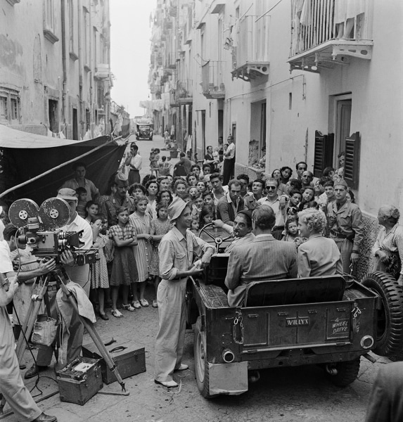 Slim Aarons, September Affair: A crowd gathers to watch Joan Fontaine and Joseph Cotten on the set of William Dieterle&#039;s film &quot;September Affair&quot;, Rome, 1949